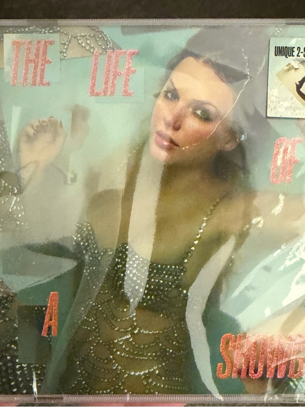 The Life of a Showgirl Album - Turquoise & Gold Cover